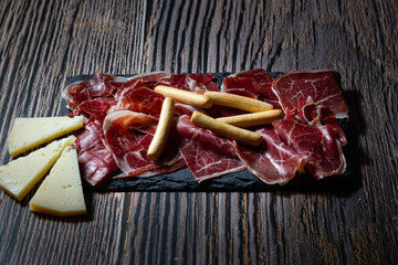 A Spanish delicacy: acorn-fed Iberian ham and old cured sheep's cheese. Mediterranean cuisine.