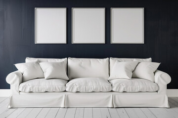 A minimalist Scandinavian living room with a white linen sofa against a dark indigo wall. Four blank empty mock-up poster frames