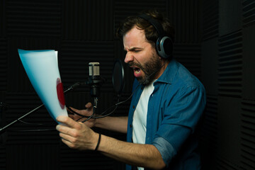 Passionate voice actor performing in sound booth