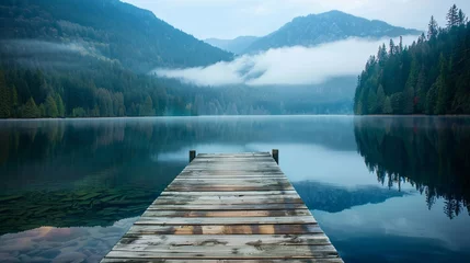 Zelfklevend Fotobehang dock on the shore of a lake, in the mountains © Vlad Kapusta