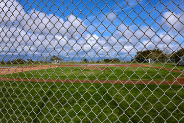 baseball field viewed through a chainlink fence