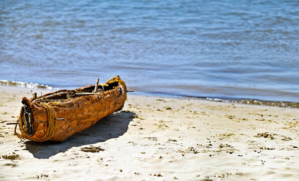 Profile view of Australian indigenous aboriginal Swamp Mahogany bark canoe on the Noosa River