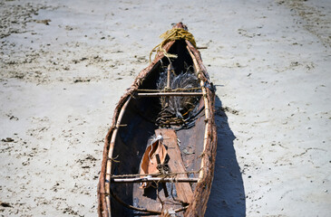 Top view of Australian indigenous Gubbi Gubbi Swamp Mahogany bark canoe on the sandy beach at Noosa...