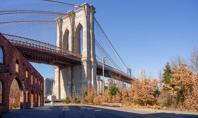 Panoramic of Brooklyn Bridge from Dumbo public park, with New York City skyscrapers in the...