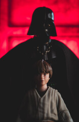 Obraz premium NEW YORK USA, APR 9 2024: young Anakin Skywalker foreshadowed by Sith lord Darth Vader - Hasbro action figures