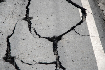 Asphalt road crack into pieces