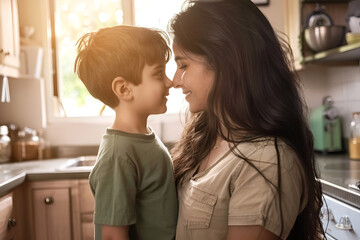 A mother and son share a tender moment, touching noses and smiling in a sunlit kitchen. - obrazy, fototapety, plakaty