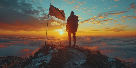 Silhouette of a person standing at the top of a mountain with a flag, metaphor for achieving environmental sustainability goals.