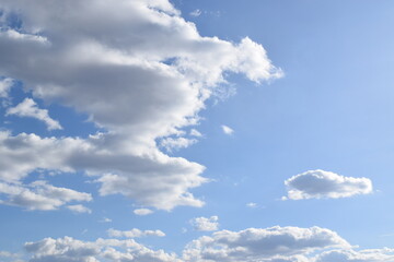 Peaceful blue sky with light clouds