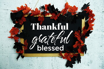 Thankful, grateful and blessed inspirational words  with maple leaf decoration