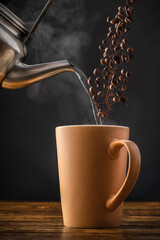 A Cup of Coffee Pouring Hot Water and Coffee Beans