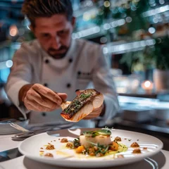 Fotobehang Luxurious dining scene chef perfects a sea bass dish © WARIT_S