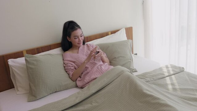 Casual Morning Smartphone Use in Comfortable Bedroom