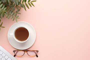 Minimalistic pink background with a coffee cup, glasses and keyboard on the right side of the picture