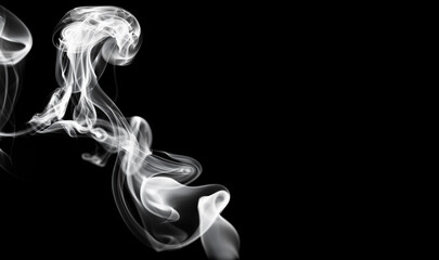 Smoke blowing on the air isolated on black background. Art images of fluffy smoke.