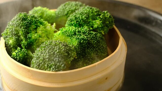 cooking broccoli in a bamboo steamer