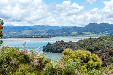 Bowentown Lookout : Maori pa site with beautiful views of the Anzac Bay with Pohutukawa blooming trees in Bay of Plenty, New Zealand