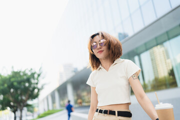 Asian white collar business woman standing outside office city building - 778627901