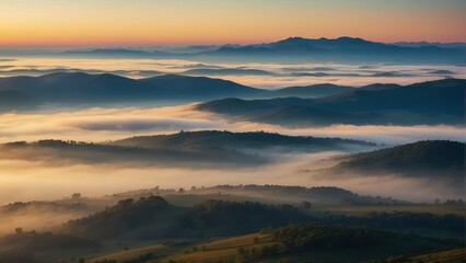 Fototapeta premium Breathtaking sunrise over fog covered hills