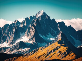 Fototapeta premium A mountain range with snow capped peaks in the background.