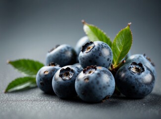 A bunch of blueberries with leaves on a gray surface. Generative AI.