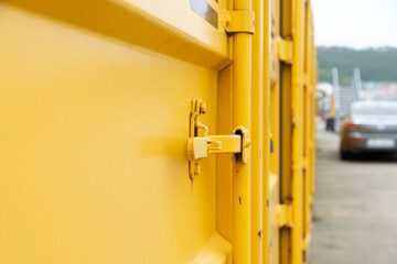 View of the yellow cargo container at the harbor