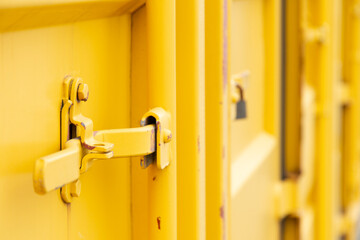View of the yellow cargo container at the harbor