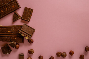 Chocolate bar pieces. Background with chocolate. Sweet food photo concept.