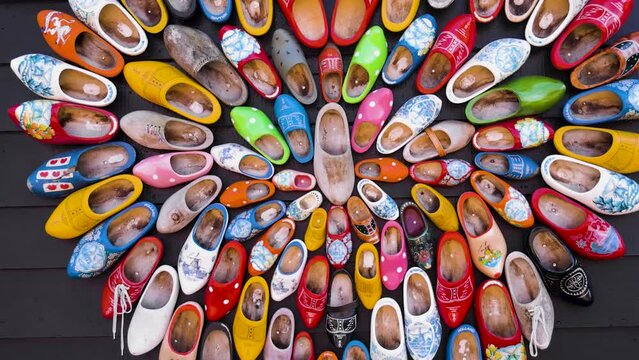 Traditional Dutch clogs, wooden shoes arranged in a heart pattern.