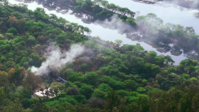 smoke releasing from forest upper view from drone