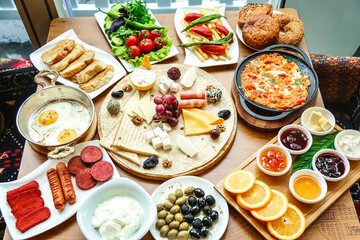 Fototapeta na wymiar Wooden Table Set With Plates of Food