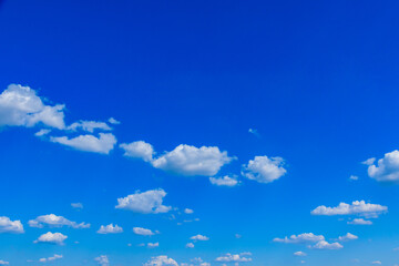White fluffy clouds in the blue sky