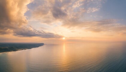aerial panoramic view of sunset over ocean colorful sky clouds water beautiful serene scene wide angle seascape drone view majestic stunning nature background best sea sky sunrise inspire views - obrazy, fototapety, plakaty
