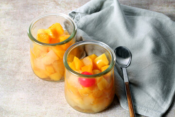 Two glass jars with fruit salad