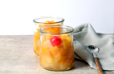 Two glass jars with fruit salad