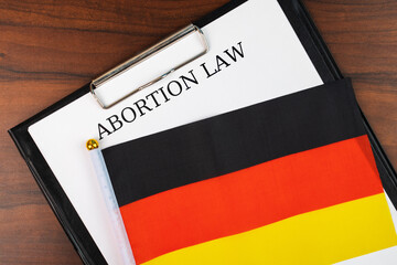 Abortion law in germany, german flag background, debate over body autonomy, freedom of decision,...