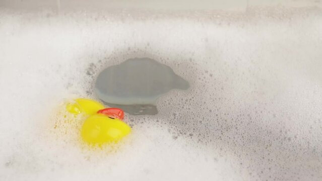 Floating rubber duck, bath relaxation, playful bath accessory, yellow ducky