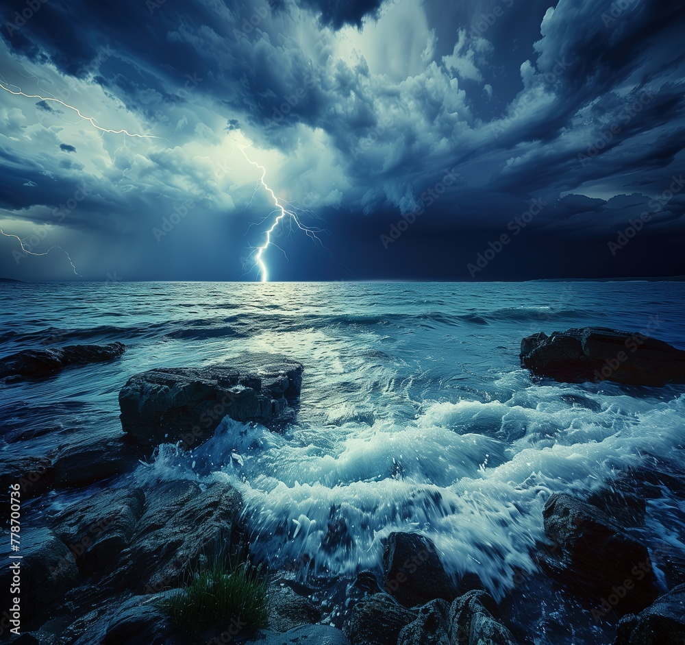 Wall mural Stunning view of the sea with rocks and lightning on dark blue sky.