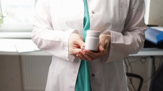 Abortion pills in doctor's hands, healthcare provider, reproductive health, woman's choice