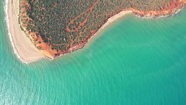 Aerial video of Cape Peron in Francois Peron national park. View from the sky with drone. Aerial footage of red sand, beach and bush in Shark Bay, Western Australia.