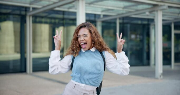 Happy, student and woman with kiss, face and peace sign for celebration and excited for her learning journey outdoor. Young person dancing and cheerful for college or university with trendy fashion