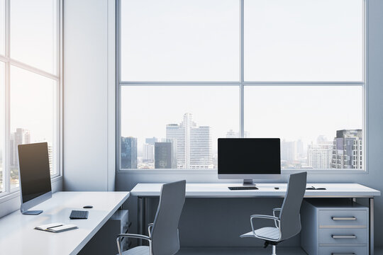 Contemporary spacious light coworking office interior with panoramic windows and city view. Workplace concept. 3D Rendering.