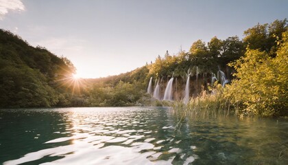 plitvice lakes water tumbles over greenery in croatia