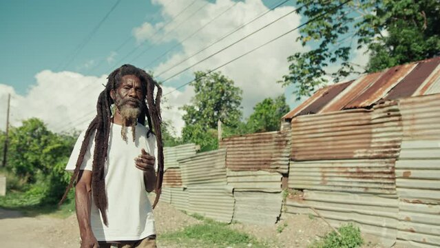 Rastafari Man in Jamaica walking down the street