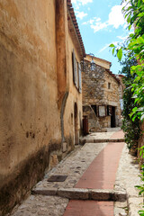 Fototapeta na wymiar Narrow street in medieval Eze village in French Riviera, France