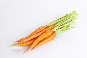 Young raw carrot heap isolated