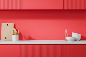 Poster Red home kitchen interior with kitchenware on counter and shelves © ImageFlow