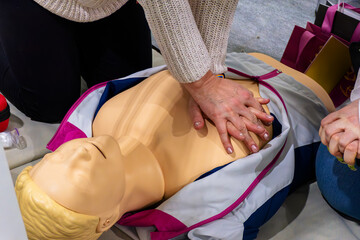 Demonstration on an emergency medical mannequin for human resuscitation.