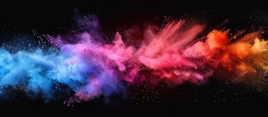 Vibrant colored powder burst suspended in mid-air after being thrown energetically - obrazy, fototapety, plakaty