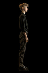 Naklejka premium Reflective Young Individual Standing Thoughtfully in Dark Ambiance Banner